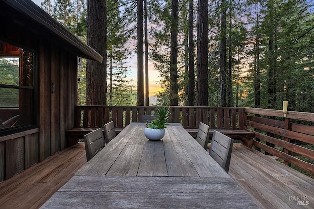 wooden deck featuring outdoor dining space