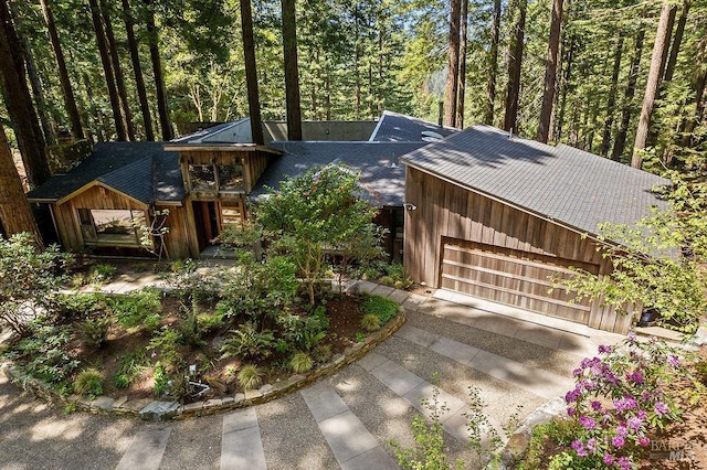 view of front of home featuring roof with shingles and board and batten siding