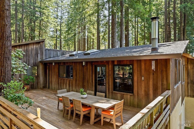 wooden deck featuring outdoor dining space