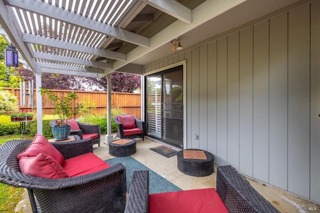 view of patio / terrace featuring an outdoor living space with a fire pit, fence, and a pergola