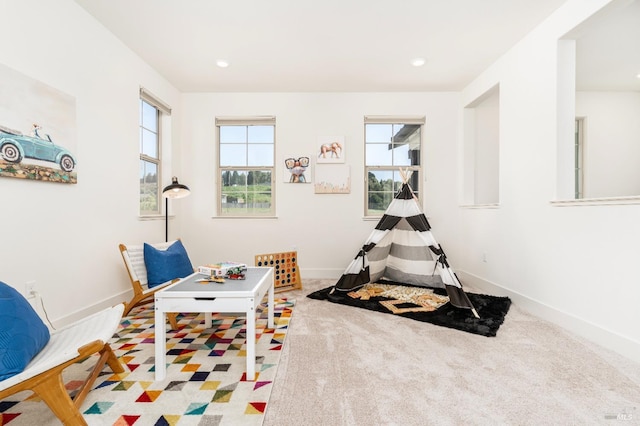 recreation room featuring baseboards, recessed lighting, and carpet