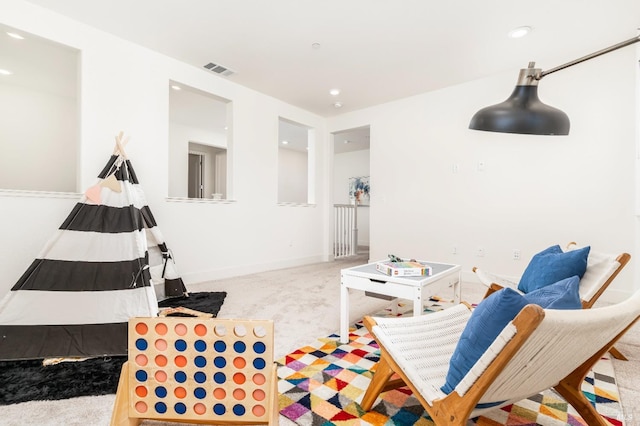recreation room featuring carpet floors, baseboards, recessed lighting, and visible vents