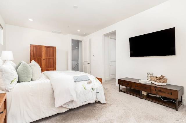 bedroom with recessed lighting, visible vents, and light carpet
