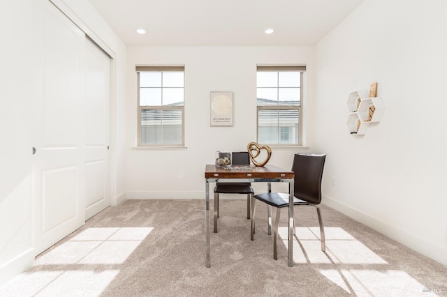 carpeted office with recessed lighting and baseboards