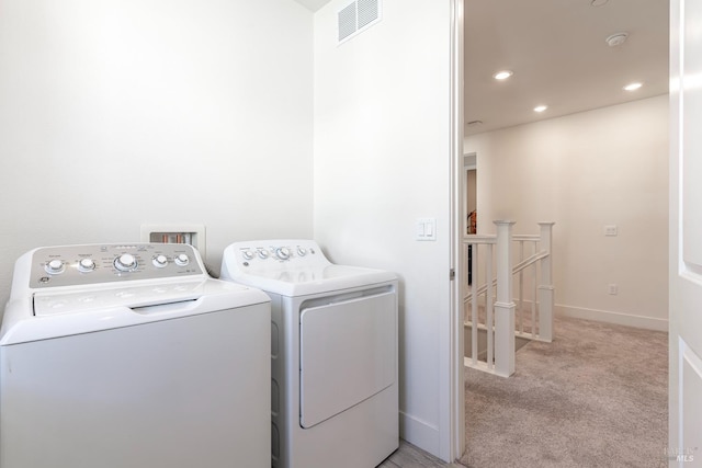 washroom featuring laundry area, light colored carpet, recessed lighting, visible vents, and washer and clothes dryer