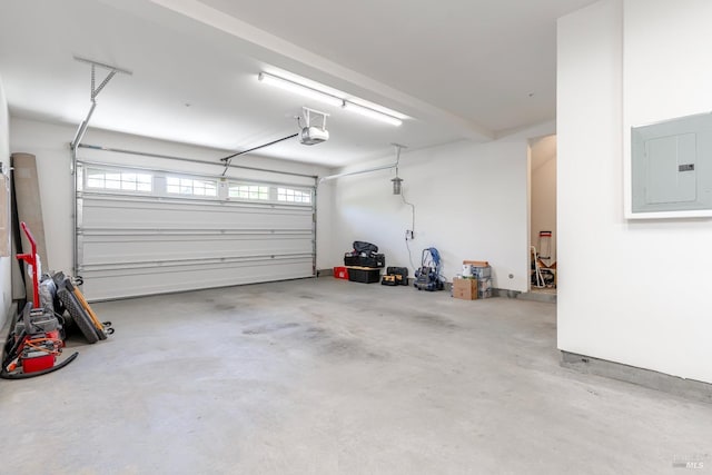 garage featuring a garage door opener and electric panel