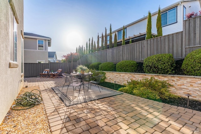 view of patio / terrace with a fenced backyard and outdoor dining area