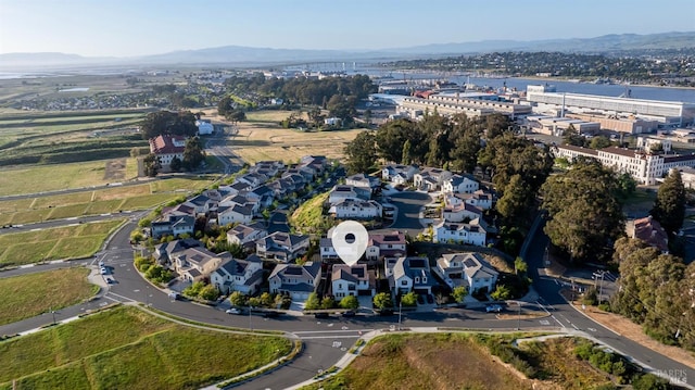birds eye view of property with a mountain view