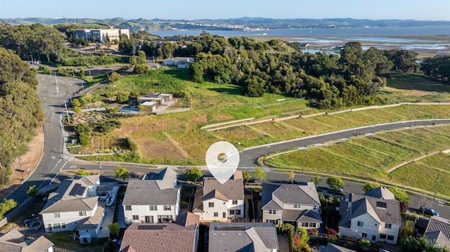 aerial view with a water view and a residential view