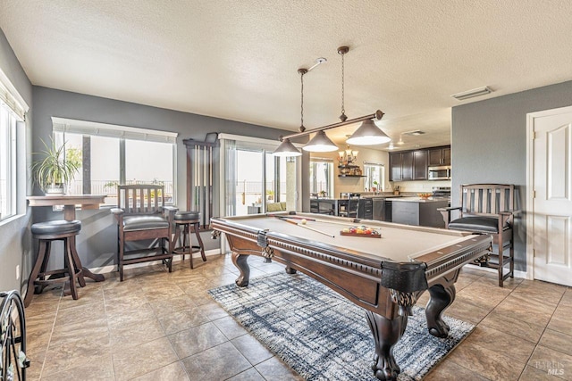 rec room with visible vents, a textured ceiling, and pool table