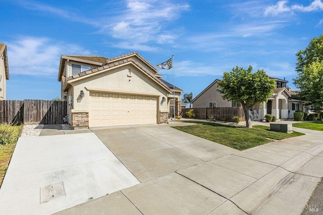 view of front of property with fence, a front yard, stucco siding, concrete driveway, and an attached garage