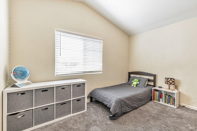 bedroom featuring carpet flooring and lofted ceiling