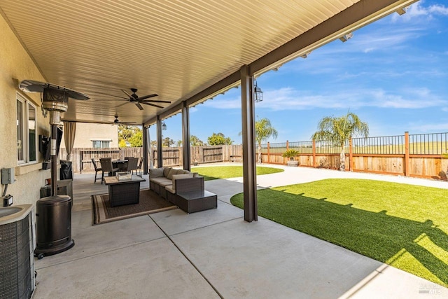 view of patio / terrace featuring central air condition unit, ceiling fan, a fenced backyard, and an outdoor hangout area