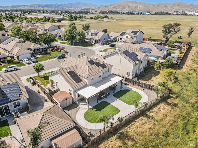 birds eye view of property with a residential view and a mountain view