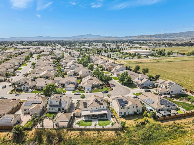 birds eye view of property with a residential view and a mountain view