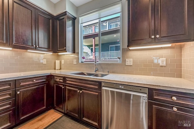 218 Johnson St, Windsor, CA 95492 - kitchen with stainless steel dishwasher, dark brown cabinetry, a sink, and backsplash