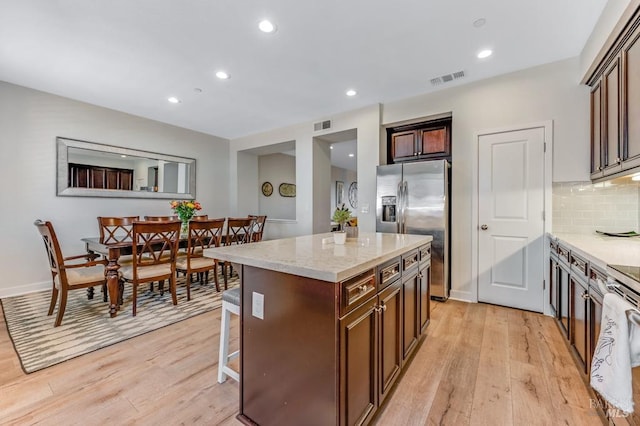 218 Johnson St, Windsor, CA 95492 - kitchen with stainless steel fridge, light wood finished floors, a kitchen island, tasteful backsplash, and recessed lighting