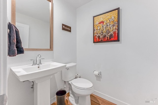218 Johnson St, Windsor, CA 95492 - bathroom featuring wood finished floors, toilet, and baseboards