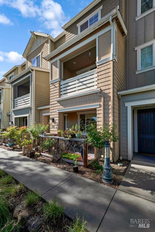 218 Johnson St, Windsor, CA 95492 - view of front of home with a balcony and board and batten siding
