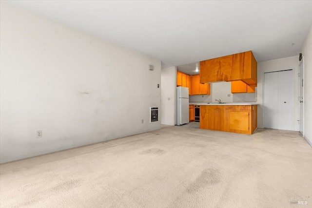 105 Virginia Ave Unit 2, Sebastopol, CA 95472 - unfurnished living room featuring light colored carpet, a sink, and heating unit