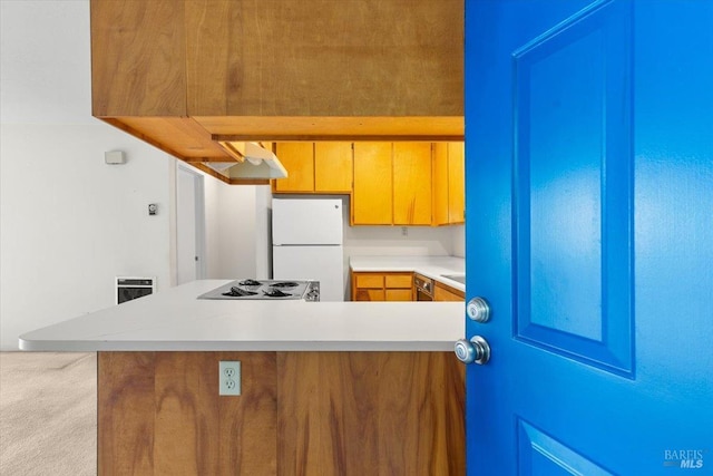 105 Virginia Ave Unit 2, Sebastopol, CA 95472 - kitchen featuring freestanding refrigerator, carpet flooring, a peninsula, electric stovetop, and light countertops