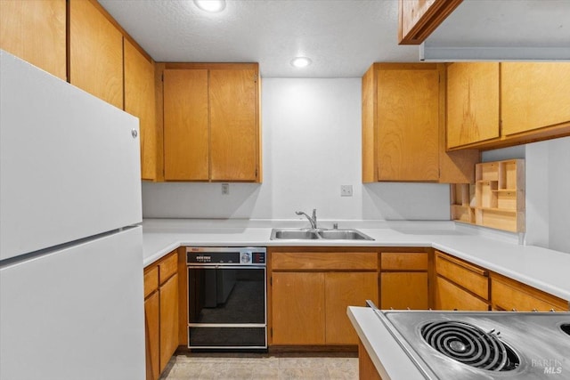 105 Virginia Ave Unit 2, Sebastopol, CA 95472 - kitchen with stainless steel appliances, a sink, under cabinet range hood, light countertops, and recessed lighting