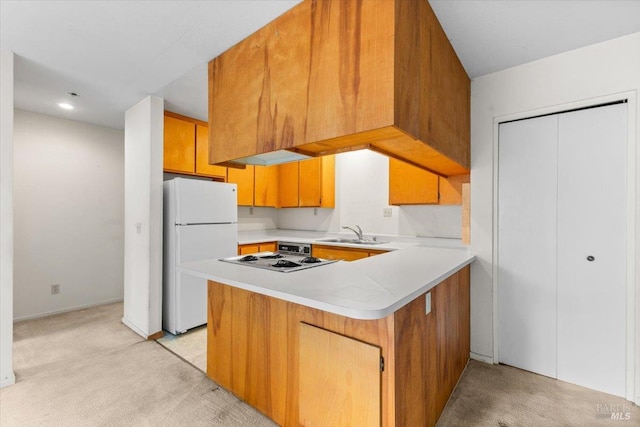 105 Virginia Ave Unit 2, Sebastopol, CA 95472 - kitchen with white appliances, light colored carpet, light countertops, and a peninsula