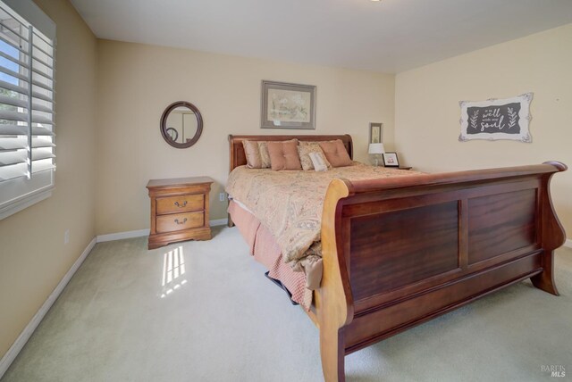 carpeted bedroom with baseboards