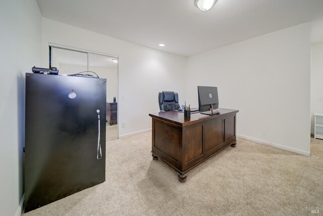 home office featuring recessed lighting, baseboards, and light carpet