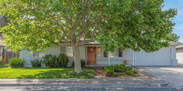obstructed view of property featuring a front yard