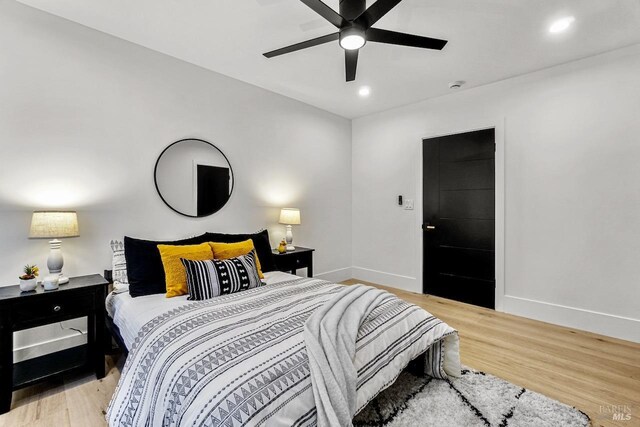 bedroom with baseboards, recessed lighting, ceiling fan, and light wood-type flooring