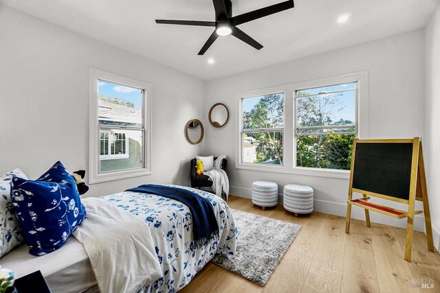 bedroom with recessed lighting, baseboards, a ceiling fan, and wood finished floors