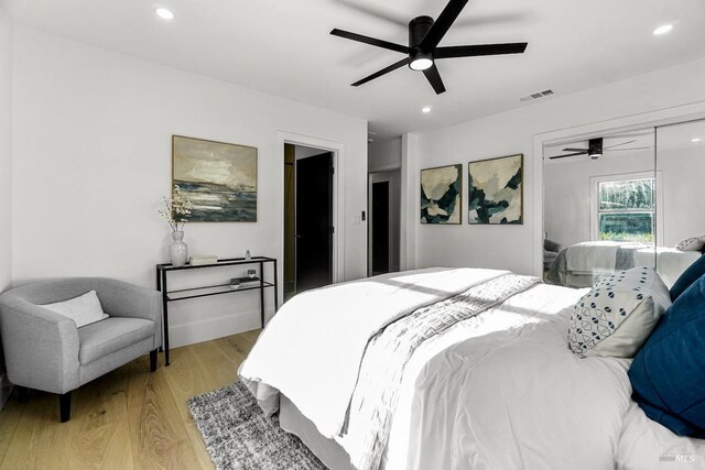 bedroom featuring a closet, recessed lighting, light wood-style flooring, and visible vents
