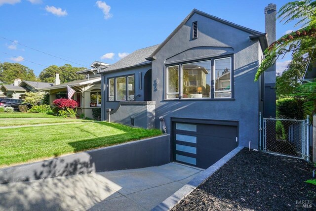 bungalow-style house featuring fence, a front yard, stucco siding, concrete driveway, and an attached garage