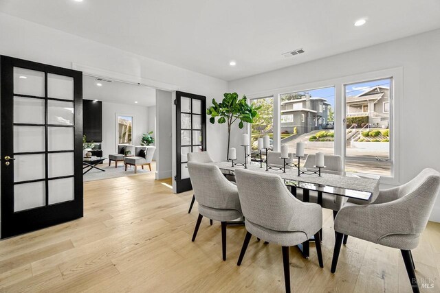 dining room with recessed lighting, visible vents, and light wood-style flooring
