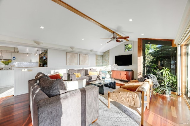 living room with vaulted ceiling with beams, ceiling fan, and dark wood-type flooring