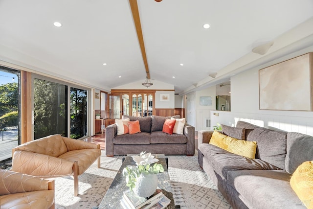 living room featuring a healthy amount of sunlight, lofted ceiling with beams, and recessed lighting