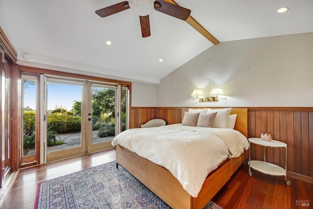 bedroom with access to outside, lofted ceiling with beams, french doors, a wainscoted wall, and wood finished floors