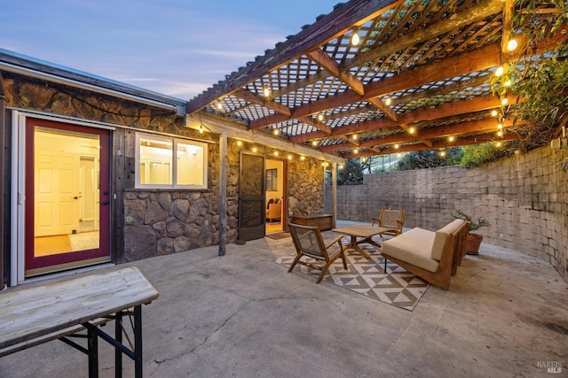 view of patio featuring a pergola and fence