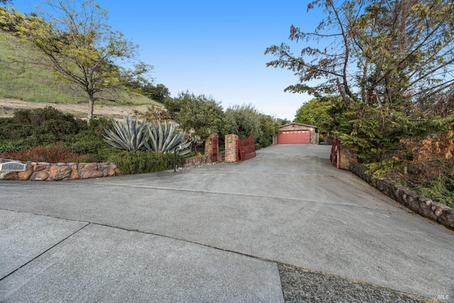 exterior space with a garage and an outdoor structure
