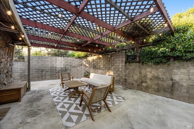 view of patio featuring fence, a pergola, and an outdoor hangout area