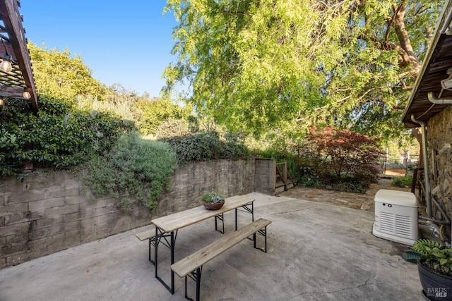 view of patio / terrace featuring outdoor dining area and fence