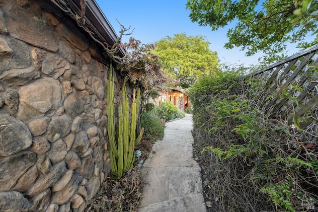 view of property exterior with stone siding