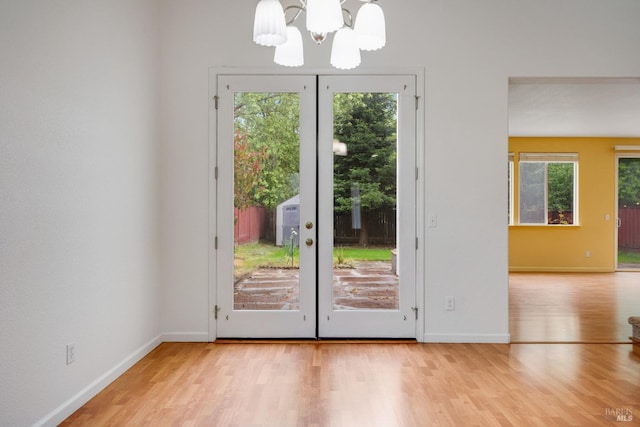 2916 Park Meadow Dr, Santa Rosa, CA 95407 - doorway with an inviting chandelier, french doors, and wood finished floors