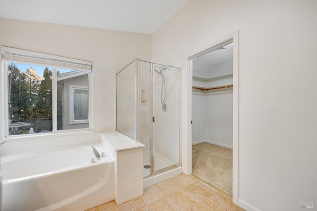 2916 Park Meadow Dr, Santa Rosa, CA 95407 - bathroom with a walk in closet, baseboards, a shower stall, and a garden tub