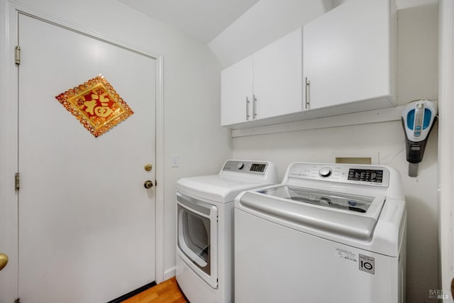 2916 Park Meadow Dr, Santa Rosa, CA 95407 - washroom featuring light wood-style flooring, cabinet space, and washer and clothes dryer