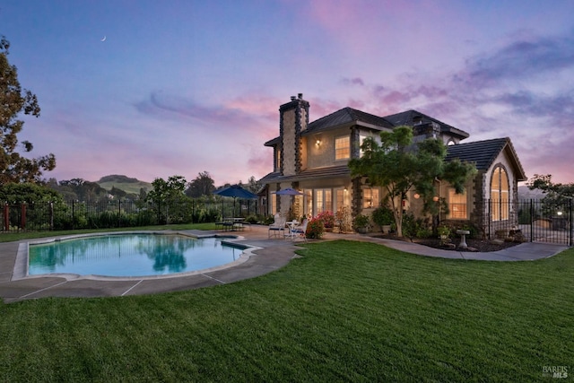 9 Canyon Ct, Petaluma, CA 94952 - pool at dusk with a fenced in pool, fence, a patio, and a yard
