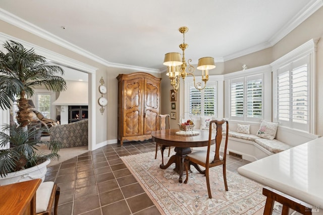9 Canyon Ct, Petaluma, CA 94952 - dining room featuring crown molding, dark tile patterned floors, a warm lit fireplace, and a notable chandelier