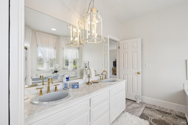 9 Canyon Ct, Petaluma, CA 94952 - full bath featuring a sink, an inviting chandelier, double vanity, and marble finish floor