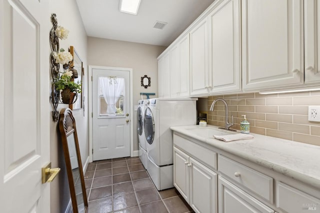 9 Canyon Ct, Petaluma, CA 94952 - washroom with visible vents, cabinet space, a sink, dark tile patterned flooring, and separate washer and dryer